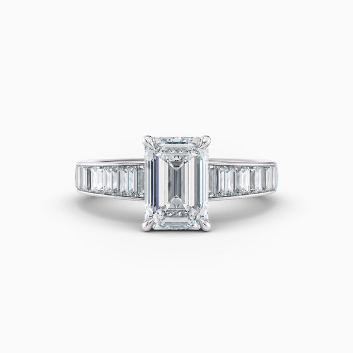 2ct emerald cut diamond ring with channel set baguetted diamonds in white gold