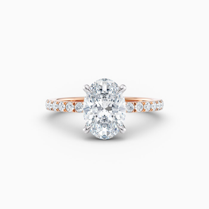 Oval cut solitaire engagement ring in rose gold