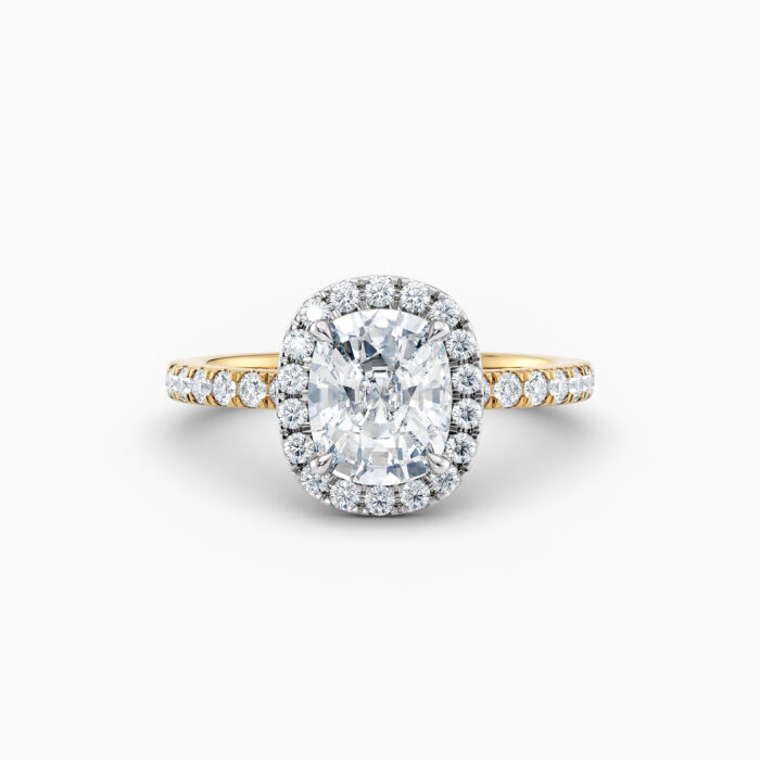 cushion cut halo engagement ring in yellow gold