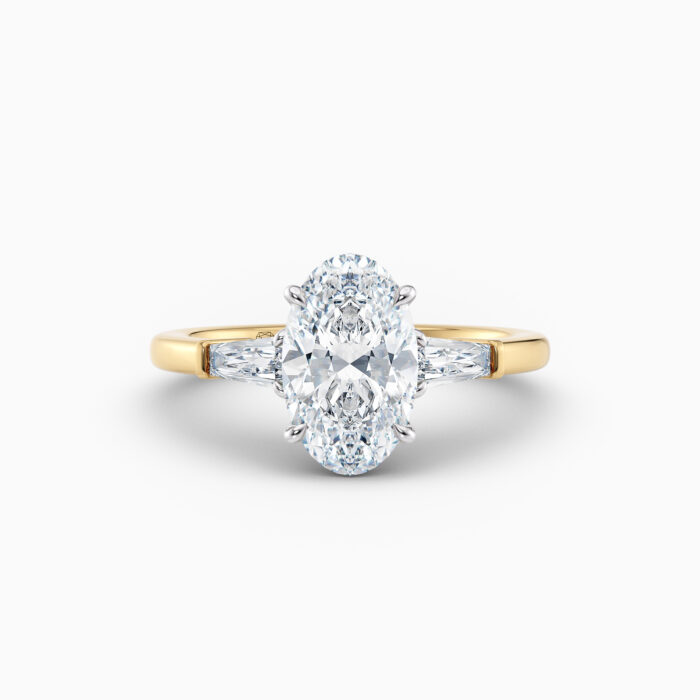 Oval 3 stone yellow gold engagement ring