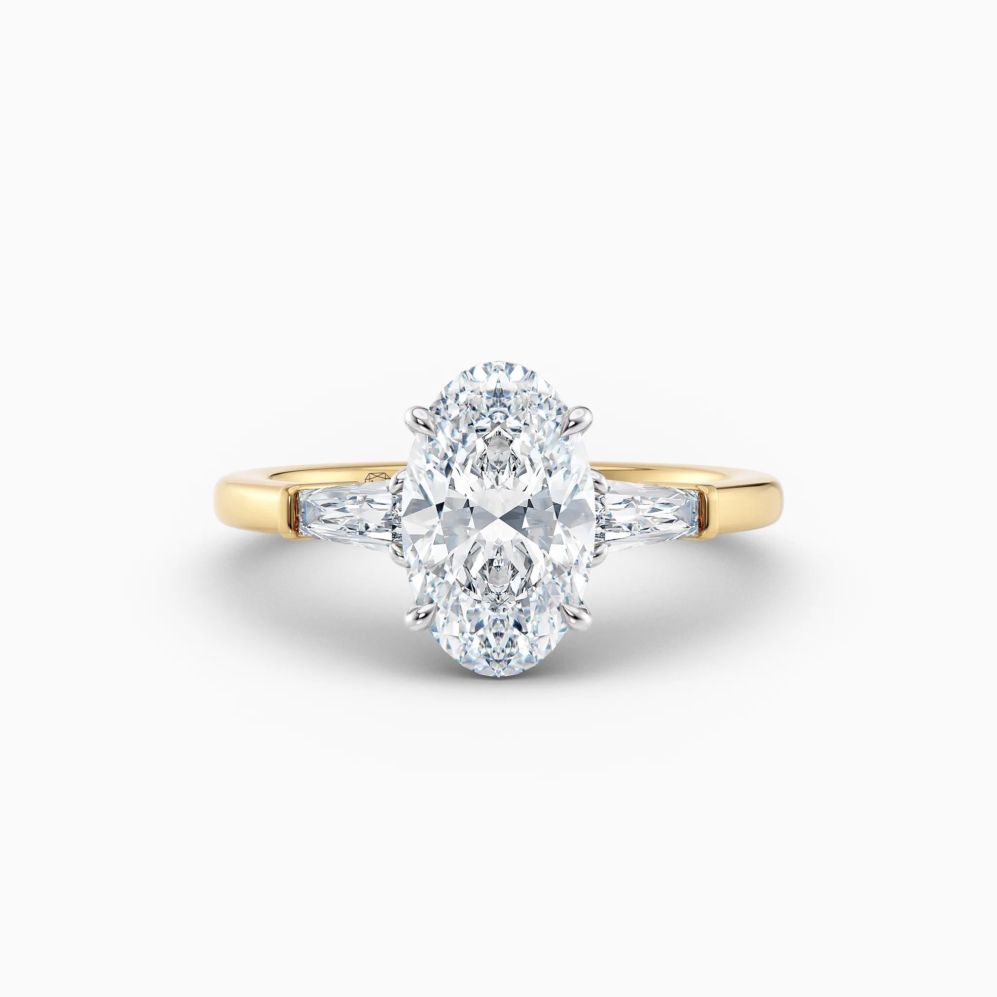 Oval 3 stone yellow gold engagement ring