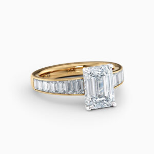 2ct emerald cut diamond ring with channel set baguette diamonds in yellow gold