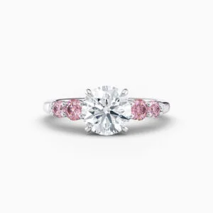 2ct centre diamond ring with round pink diamonds either side in platinum