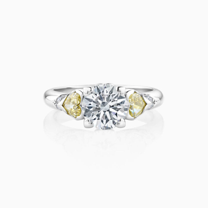 3 stone engagement ring with white , yellow and pink diamonds in platinum
