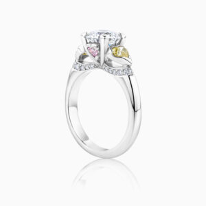 side view 3 stone engagement ring with white , yellow and pink diamonds in platinum