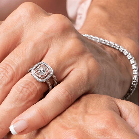 How to Choose the Perfect Engagement Ring in Brisbane (2026 Guide) 29 Pink diamond cushion cut engagement ring on hand